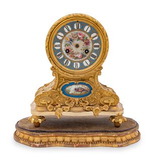 A Louis XVI Style Gilt Bronze and Sevres Style Porcelain Inset Mantel Clock