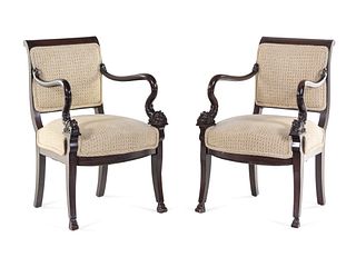 A Pair of Directoire Style Carved Walnut Fauteuils