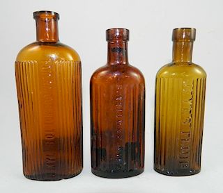 3 amber Poison bottles