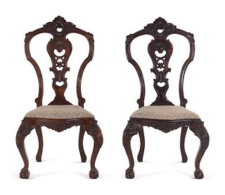 A Pair of Continental Carved Walnut Side Chairs