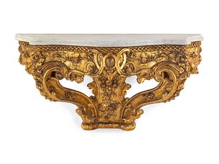 An Italian Rococo Carved Giltwood Marble Top Console d'Applique