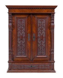 A Renaissance Revival Carved Walnut Side Cabinet