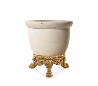 A Cast Stone Jardiniere with an Italian Baroque Style Giltwood Base