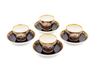 A Set of Four Berlin (K.P.M.) Parcel Gilt Cobalt Ground Porcelain Teacups and Saucers