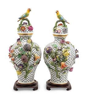 A Pair of Continental Porcelain Covered Urns