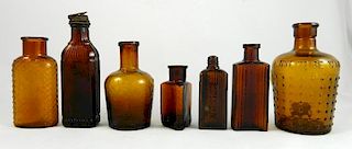 7 amber Poison bottles
