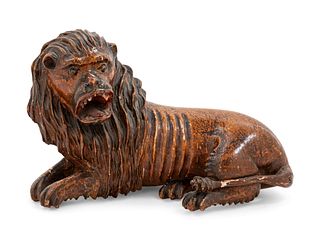 A Carved Wood Figure of a Lion