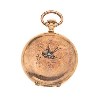 Reloj de bolsillo Montandon Geneve. Caja en oro amarillo de 14k. Movimiento manual. Carátula color plata con vistas en dorado,...
