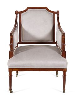 A Regency Style Carved and Inlaid Mahogany Armchair