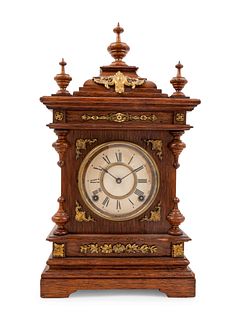 An Ansonia Cabinet A Brass Mounted Oak Shelf Clock