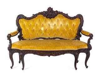 A Rococo Revival Carved Walnut Settee