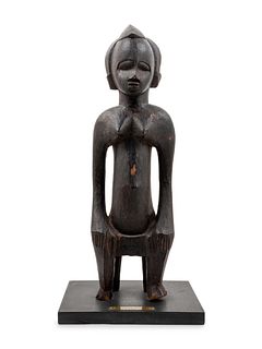 A Senufo Style Carved Wood Figure
