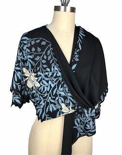 Black wrap with turquoise leaves and honey bees.