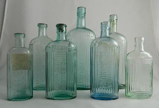 7 Poison aqua oval bottles