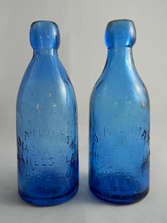 2 Soda blue bottles - J. A. Lomax