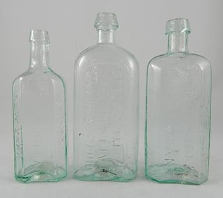 3 aqua medicine bottles