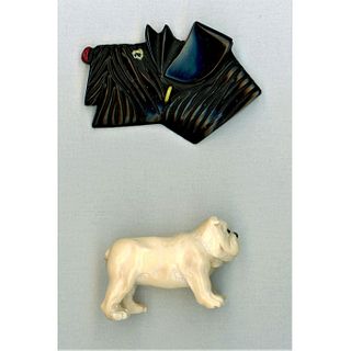 A Pair Of Large Dog Buttons In Assorted Materials.