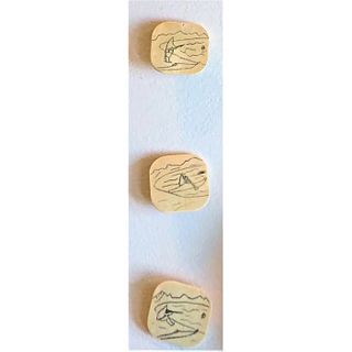 A Set Of Three Eskimo Engraved And Carved Buttons