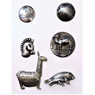 A Small Card Of Animal Buttons In Silver