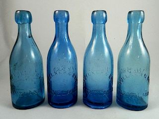 4 Soda round cobalt blue bottles