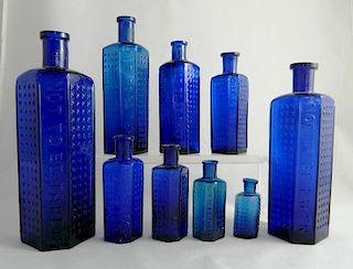 9 Poison cobalt irregular hexagonal bottles