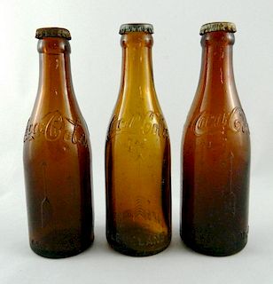 3 Coca Cola Arrow Amber bottles