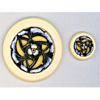 A Pair Of Casein And Enamel Buttons