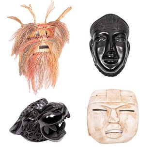 Lote de 4 máscaras. México. Siglo XX. Diseños antropomorfos y zoomorfos. Elaboradas barro negro, mármol y palma tejida.