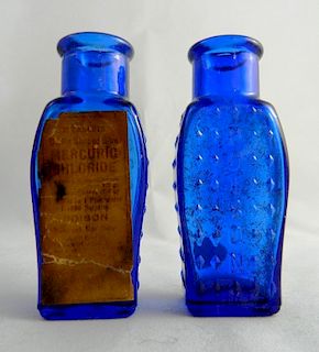 Poison - 2 cobalt coffin shape bottles