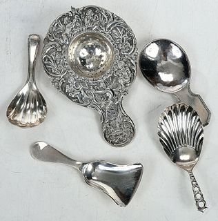Four Silver Tea Caddy Spoons and Strainer