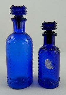 Poison 2 round bottles with diamond pattern