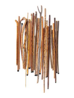 A Large Collection of Carved Canes and Walking Sticks