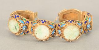 Chinese Silver Enameled Bracelet having gold wash filigree with enameled flowers and leaves mounted with four jadeite carved plaques...
