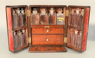 Mahogany Medical Apothecary Box having two doors opening to fitted interior with six bottles on each door, four larger bottles acros...