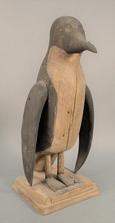 Folk Art Penguin, painted hardwood, crazing to paint.
height with stand: 23 inches, width: 10 inches. 
Provenance: The Estate of Diana Atwood Johnson