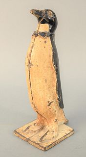 Cast Iron Penguin Door Stop, original paint with bowtie.
height 11 inches, width 4 inches. 
Provenance: The Estate of Diana Atwood Johnson