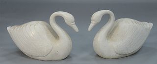Pair of Cast Iron Life Size Swans painted white.
height 20 inches, length 32 inches. 
Provenance: Provenance: The Provenance: The Estate of Diana Atwo