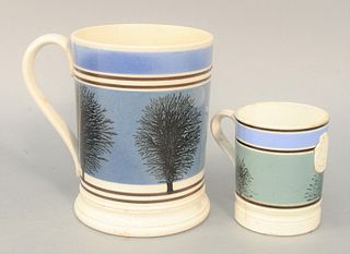 Two Mocha Mugs, each with tree decoration, one with makers mark.
heights 3 3/4 inches and 6 inches.
Provenance: Estate of Michael Co...