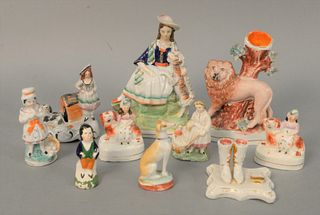 Ten Staffordshire Figures and Articles to include a lion figure, wear appropriate to age, (one small figure with repaired base).
hei...