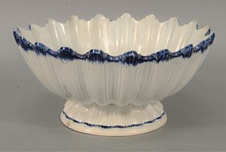 Soft Paste Footed Bowl with scalloped top with blue highlights, one chip, circa 1800 - 1820.
height 5 1/8 inches, diameter 10 3/4 in...