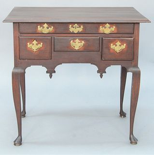 Queen Anne Cherry Lowboy having large rectangular top over one long drawer over three short drawers set on cabriole legs ending in p...