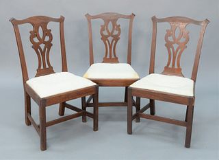 Chippendale Mahogany Side Chairs, set of three, with pierced carved splat over slip seats on molded edge front legs and H-stretchers, (one chip to cor