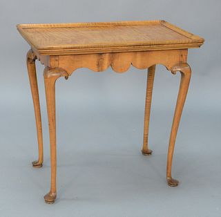 Queen Anne Maple and Tiger Maple Tea Table, having rectangular dish top over scalloped skirt set on cabriole legs ending in pad feet...