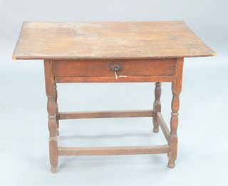 Tavern Table, having three board top on base with turned legs and box stretchers; chestnut, poplar and maple.
height 27 1/4 inches, top 25 1/4" x 38".