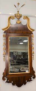 Federal Mahogany Mirror, having gilt urn of flowers over broken arch top, line inlaid frame.
Provenance: From the Lance & Irma Kelle...
