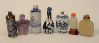 Group of Seven Snuff Bottles, to include two jade or hardston; one purple quartz; three blue and white along with blue and brown wit...