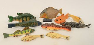 Group of Ten Fish, nine decoys, hand-carved wood with metal fins along with stuffed piranha.
5 inches - 9 inches.
Provenance: From t...