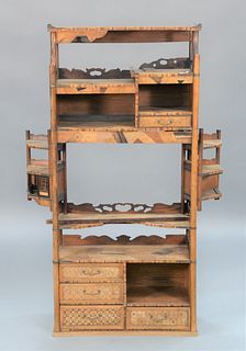 Japanese Inlaid Cabinet having parquentry inlays with shelves and drawers.
height 57 1/2 inches, width 27 1/2 inches.