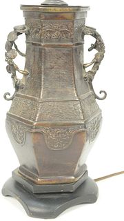 Chinese Archaic Style Bronze Urn shaped with leaf handles made into a table lamp.
total height 24 1/2 inches, vase 9 3/4 inches.