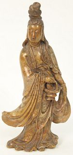 Chinese Carved Soapstone Figure, standing Guanyin, wearing a robe intricately carved, (repaired neck), 18th or 19th century.
height ...